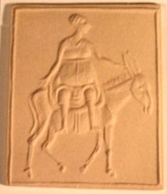 Woman Riding a Donkey